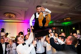 At traditional jewish weddings, the couple is seated on chairs and guests dance before them with masks, silly costumes, and props. Are You Looking For A Jewish Wedding Photographer London Weddings