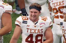Texas defenders jake ehlinger, left, and b.j. F9effodotpyv8m