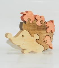 Each box is filled with unique shaped jigsaw puzzle pieces carefully cut to the shape of the object, animal, building, person and more. Wooden Puzzle Forest Hedgehog Toy Wooden Handmade Toys Etsy In 2021 Wooden Puzzles Hedgehog Waldorf Toys