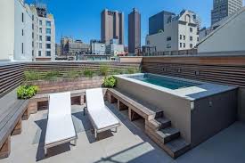 These Urban Pools Will Make You Crave Summer Small Backyard Pools Endless Pool Backyard Backyard Pool
