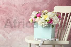 Maybe you would like to learn more about one of these? Box With Bouquet Of Beautiful Flowers On Wooden Chair Against Color Background Stock Photo By Africa Images