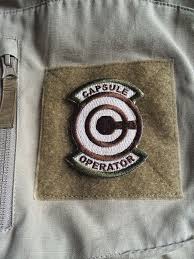 Dragon Ball Z Capsule Operator Velcro Back Morale Patch Tan And Green Dragon Ball Z Dragon Ball Morale Patch