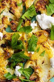 Spiced Roasted Cauliflower With Feta And Garlic Recipe Recipe Garlic Recipes Recipes Roasted Cauliflower