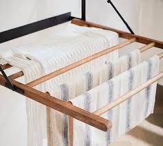 Make a beautiful star shaped clothes drying rack that magically expands and folds into a tiny footprint! Trenton Laundry Drying Rack Pottery Barn
