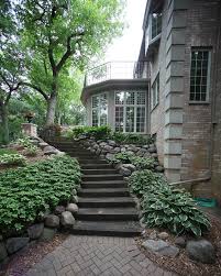 It should be of the hill, belonging to it, so hill and house could live together each the happier for the other. this idea from frank lloyd wright continues to guide many architects challenged by a home under construction on a steep terrain. Oconomowoc Whole House Remodel Traditional Landscape Milwaukee By Barenz Builders Traditional Landscape Landscape Design Backyard