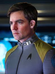 I've been doing Photoshop composites of my family in Starfleet uniforms,  (you guys seemed to like my metamour Jess as Blazin' Bev,) so I thought I'd  post the one I did of