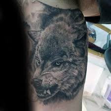 50 Realistic Wolf Tattoo Designs For Men Canine Ink Ideas Wolf Tattoo Design Wolf Tattoo Tattoo Designs Men