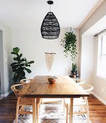 Minimalist Boho Dining Room With Hanging Plants And Black Rattan Chandelier Smooth Walnut Dining Tab Boho Dining Room Dining Room Small Minimalist Dining Room