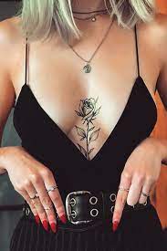 Rose Tattooed Down The Centre Of The Chest Www Otziapp Com Rose Tattoos For Women Tattoos Tiny Rose Tattoos