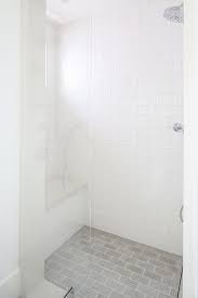 Grey and white shower floor tile. Seamless Glass Shower Design Ideas