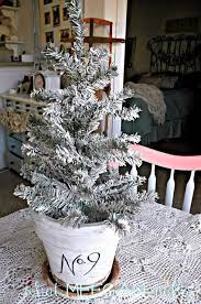 Under 3 Diy Flocked Christmas Tree What Meegan Makes Potted Christmas Trees Flocked Christmas Trees Christmas Decorations Diy Outdoor