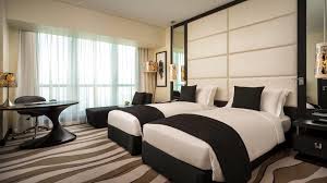 Bed features include raised panels on the headboard and footboard. Sofitel Abu Dhabi Corniche Superior Room 2 Single Beds City View