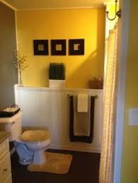 Bathroom — this richly crafted bathroom gets a boost from the warm yellow stool underneath a sink. Yellow Gray Bathroom Ideas On Pinterest Yellow Bathrooms Gray Yellow Bathrooms Yellow Bathroom Walls Yellow Bathroom Decor