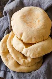 This Homemade Pita Bread Recipe Puffs Up Beautifully To Form A Pocket Inside Learn How To Make Pita Bread Wit Pita Bread Recipe Homemade Pita Bread Pita Bread