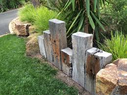 Vertical Sleepers As Retaining Wall Or Edging Landscaping Retaining Walls Native Garden Australian Native Garden