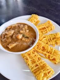 *bahan untuk kari ayam : Roti Kirai Dan Kari Ayam Chicken Curry And Net Pancake Well Made Roti Jala Is Tender And Is Tasted Perfect To Dip With Chicken Curry That Makes It More Flavorful Picture