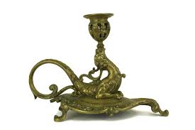 Antique brass dragon candle holder. An Antique Brass Chamberstick With Magnificent Dragon Figurine Dating To The Late 1800s The French Candle Holder French Candle Dragon Figurines Antique Brass