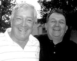 Hometown athlete playing with big dogs