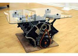 The engine block coffee table is yet another table with a base crafted from a rover v8 engine mounted on chrome tow bar covers. Mustang Engine Block Coffee Table