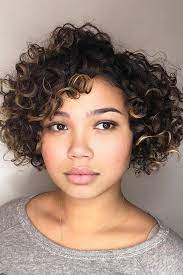 You just need to spike your short hair and cut short on the sides to reduce the round look on the face. 55 Beloved Short Curly Hairstyles For Women Of Any Age Lovehairstyles