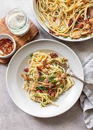 Add your cooked pasta to the sauce, and toss through to combine. Tasty Tuna Pasta With Garlic And Olive Oil Familystyle Food