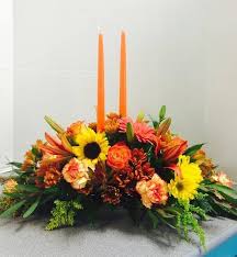 Long And Low Centerpiece With 2 Orange Candles Roses Alstroemeria Lilies Red Lilies Coral G Orange Flower Bouquets Thanksgiving Floral Thanksgiving Flowers