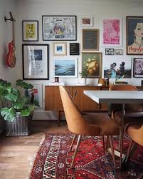 In the eclectic living room above, the black and white palette balances the more delicate traditional chairs with the bold silhouette of the leather sofa, giving them equal weight. 70 Warm And Cozy Living Room Decor Inspirations Dreamhouse Livingroomdesign Livingroomdecor Dining Room Wall Decor Vintage Living Room Eclectic Living Room