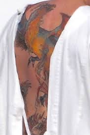 Early last week, new photos revealed that the massive, multicolored tattoo of a phoenix rising from the. Is Ben Affleck S Giant Back Tattoo Of A Phoenix Real An Investigation