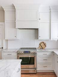 Kitchen remodel with white inset cabinets by crystal on the perimeter and custom color on custom island cabinets. Inset Kitchen Cabinets On Semi Custom Budget