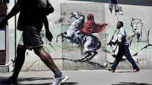 Here's what we know about the artist whose identity remains under a cloak of secrecy. Who Is Banksy The Top Theories And How He Keeps His Identity A Secret The National