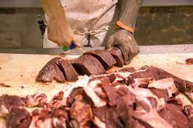 Exotic meat market offers wild camel meat imported from australia. A Worker Slices Feral Camel Meat Abc News Australian Broadcasting Corporation