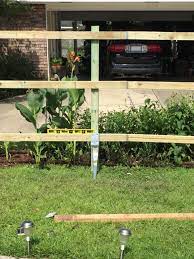 Safety concerns when digging fence post holes. How To Build A Straight Fence Using Post Anchors Ozco Building Products