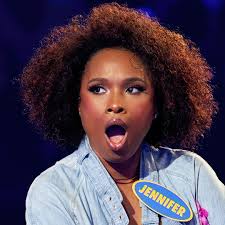 The question is... "Fill in the BLANK... Instead of sitting at my desk, I  wish I was lying