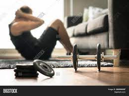 The first step to do so, would be to lie face up on the floor, or any unyielding flat surface. Home Workout Man Image Photo Free Trial Bigstock