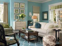 Different intensities of gray on walls, furniture, and window treatments play with bright pops of pink and teal for a colorful yet sophisticated effect. 10 Living Rooms That Boast A Teal Color