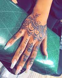 For christians, it symbolizes strength and stability. 20 Hand Tattoo Ideas From The Celebrities That Love Ink Henna Tattoo Hand Mandala Hand Tattoos Hand Tattoos For Women