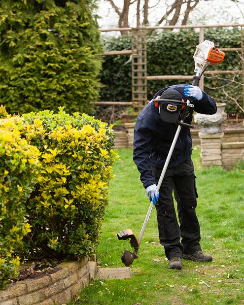 Spring garden recovery team clearing winter debris in Erith