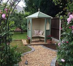 Attractive curved roof arbour with diamond trellis side and rear panels. Pin On Gardening