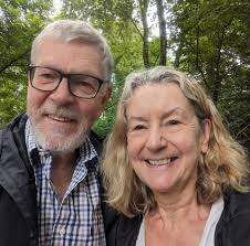 Our dog likes running through flower beds and subsequently flattens them.  Any suggestions for very hardy wildlife benefitting plants? I'm thinking  shrubs might just be the answer.