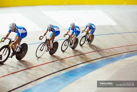 World class racing events are held throughout the summer months. Track Cycling Team Riding In Velodrome Following Track Cyclist Stock Photo 199747190