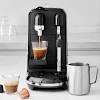The front of the machine has the drip tray, which has a small metal. 1