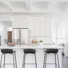 See more ideas about island stools, stools for kitchen island, bar stools. Black Low Back Barstool On White Island White Kitchen Bar Stools Modern Bar Stools Kitchen Kitchen Bar Stools
