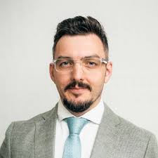 Waterproofing over tiles is a suitable solution? AS4654.2 does not list  ceramic tiles as a suitable substrate so this would not be considered DTS  compliant. But could it be done in a