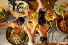 The setup encourages guests to sit, eat and talk to those seated nearby, rather than mill about mingling and sampling at casual food stations. Friends Celebrating With An Italian Dinner Party Stock Photo Picture And Royalty Free Image Image 110094492