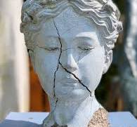 Head shaped flower pot cracked making the face look sad ...