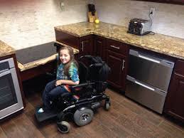 The lighter stain allows the wood grain to be more visible. Riverside Ca Accessible Kitchen Gamburd Inc