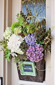 12 Beautiful Decorations To Hang On Your Door That Aren T Wreaths Door Decorations Spring Decor Wreaths