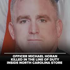 Greensboro, North Carolina Police Officer Michael Horan was killed in the  line of duty Monday morning while responding to reports of an armed man  inside a Food Lion grocery store. The suspect