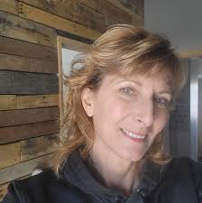 What are some historical pictures and information about the building where  KeniRae's Frozen Dreams Cafe is located?