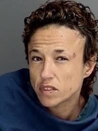 Police: Woman found naked, eating in someone else's home